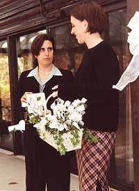 Rachel and Elizabeth give out flowers.