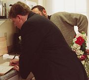 Mike signs the parish register.