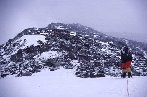 Approaching Camp 2 (7,650 meters) visible in the distance.  The climber 
	in the foreground is at about 7,500 meters.