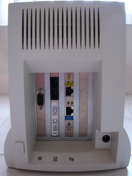 The InterJet 140 Indigo, rear: a serial port, the ISDN card labeled "ISDN CE168 X", and the Perimeter and Office Network Ethernet ports.