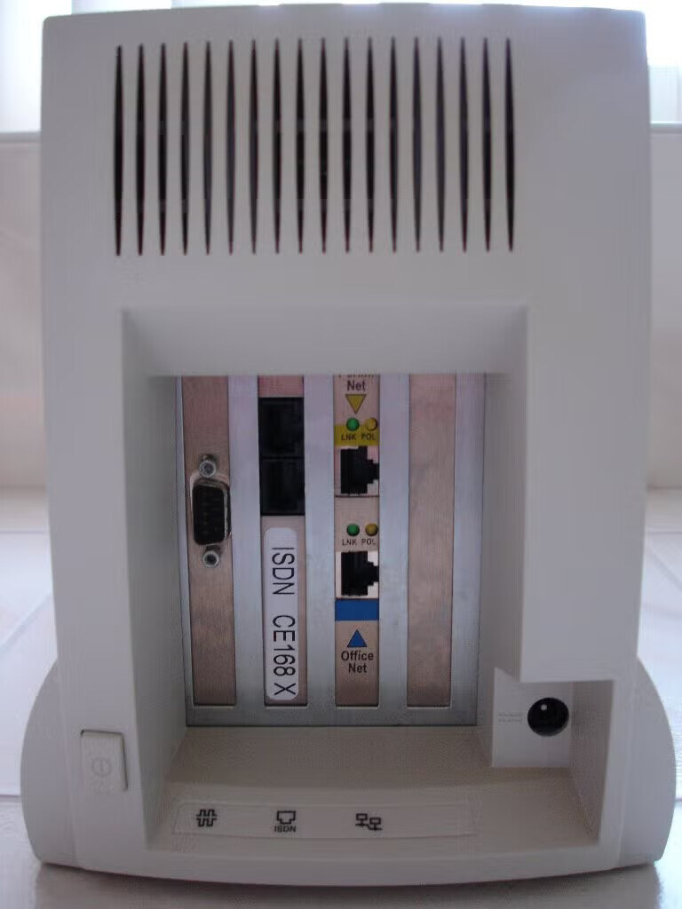 The InterJet 140 Indigo, rear: a serial port, the ISDN card labeled "ISDN CE168 X", and the Perimeter and Office Network Ethernet ports.