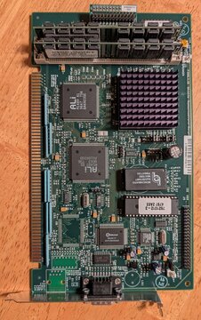 The InterJet I mainboard out of its chassis: the ALi M1489 and M1487 chipset, the boot ROM, two 72-pin memory modules, and along the left the card edge that plugs into the backplane.